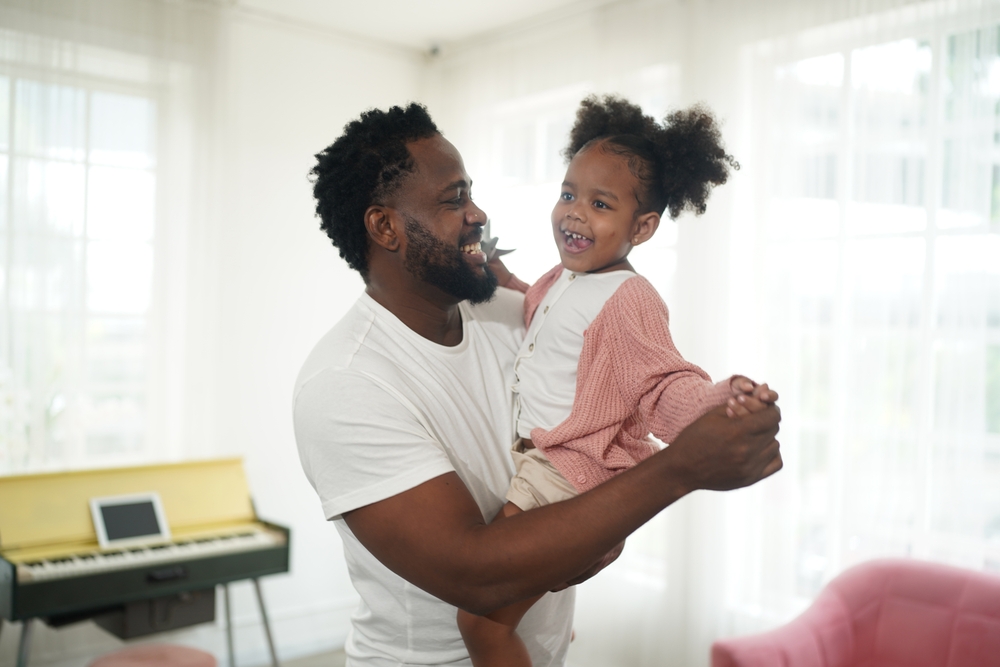 Shot,Of,Happy,Interracial,Family,Of,Mother,Father,And,Their