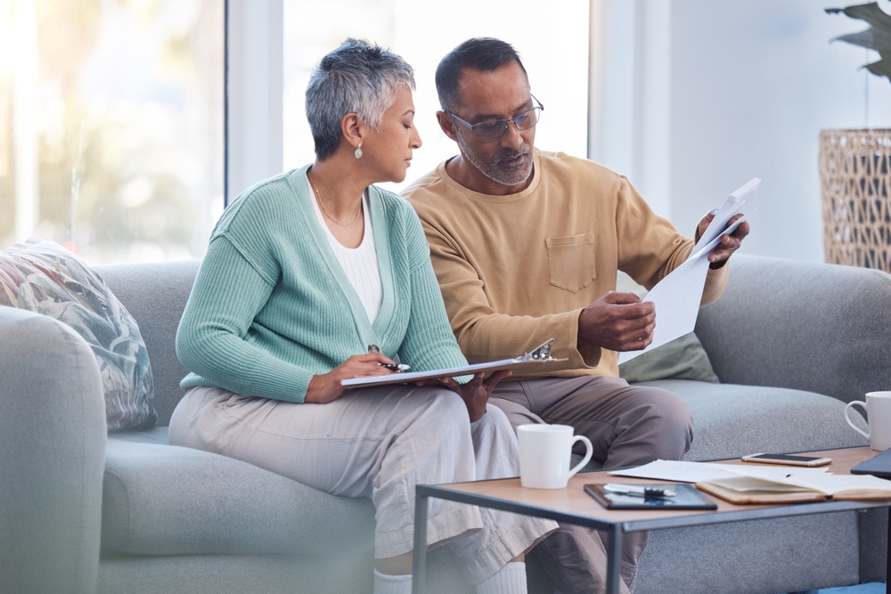 Finance,,Documents,And,Senior,Couple,On,Sofa,With,Bills,,Paperwork